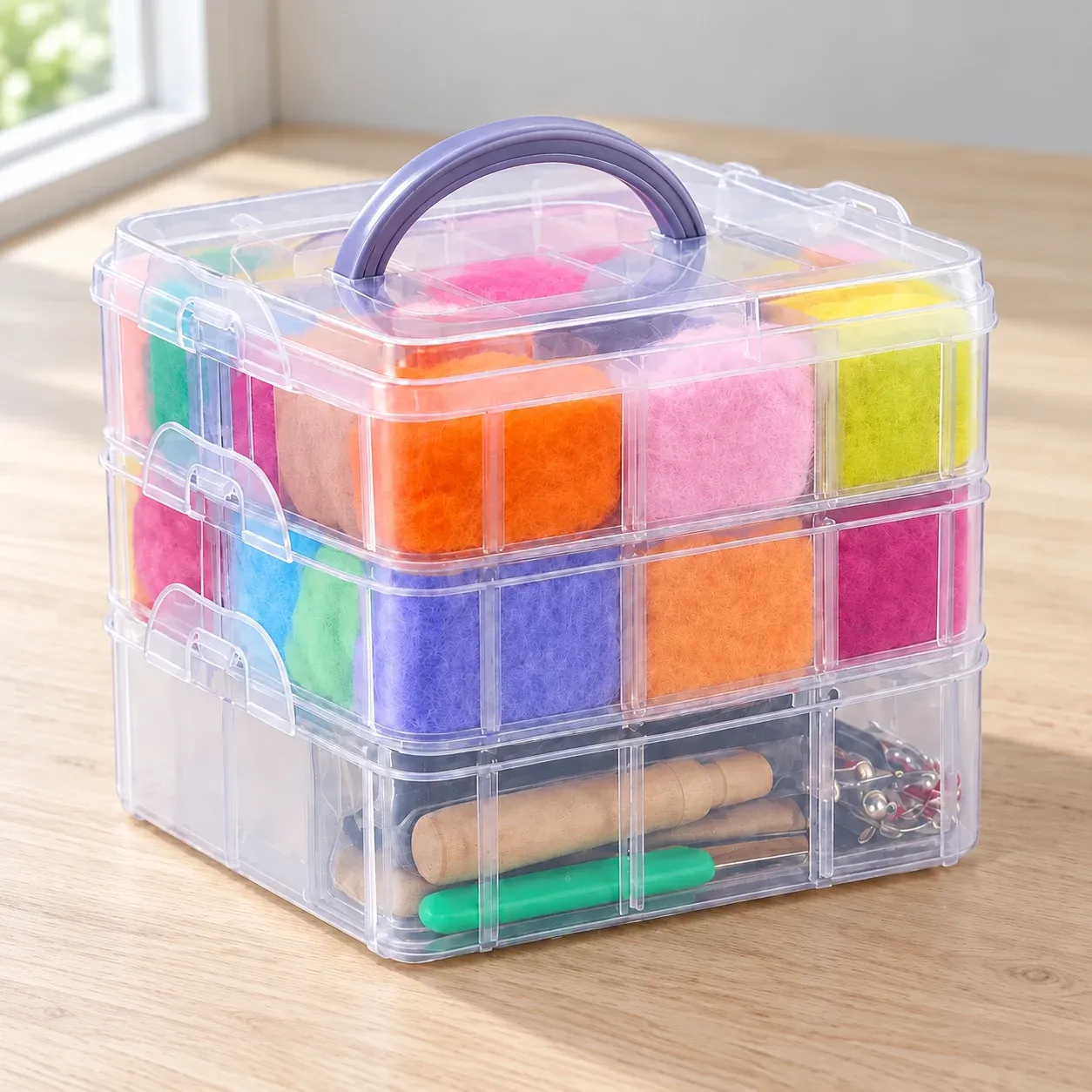 One three-tier wool felting box with a purple handle