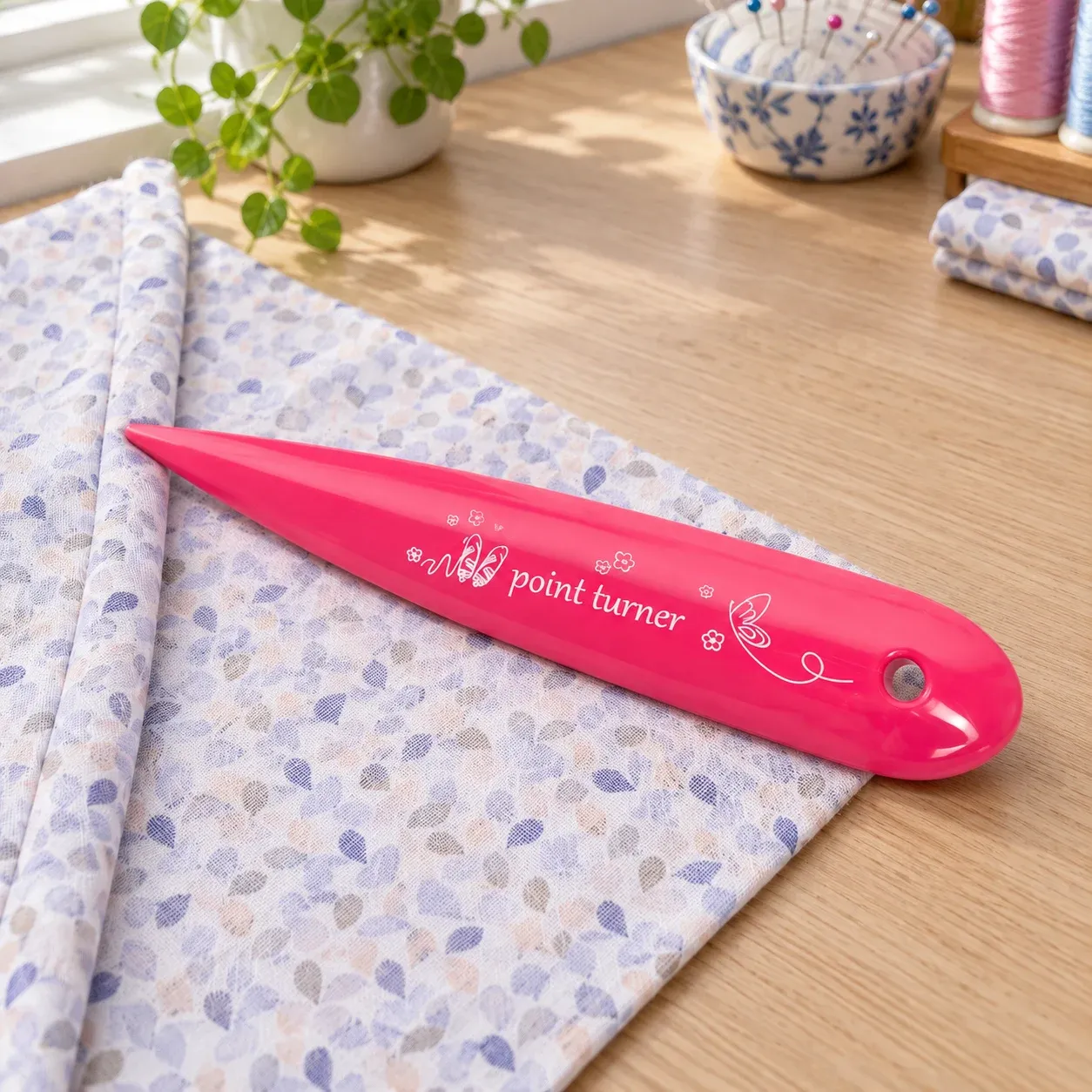 Aveline Point Turner beside a folded cotton seam