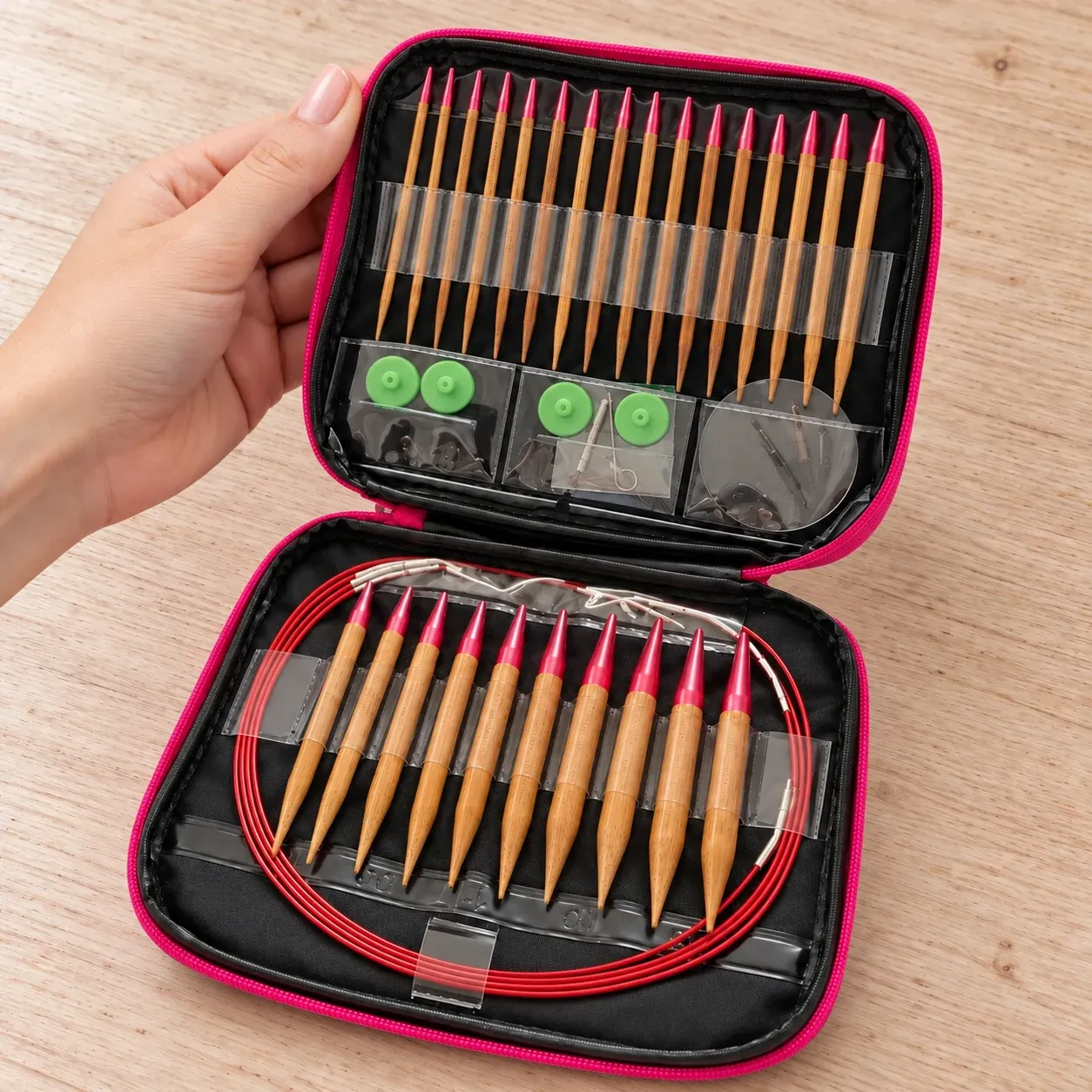 Hand holding the open bamboo needle set to show scale